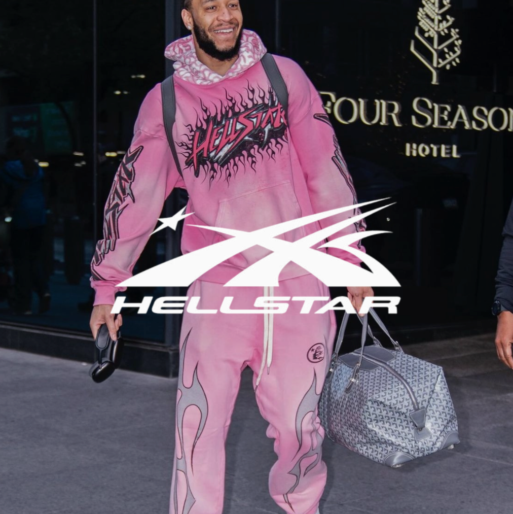 Hellstar logo mit einem Sportler in rosa Hellstar trackuit der vor einem Hotel post.