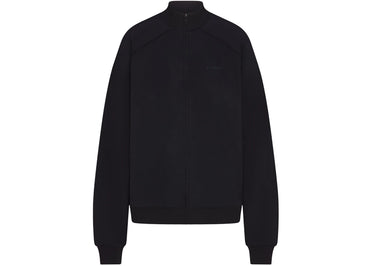 Veste de survêtement oversize Nike x SKIMS pour femme, coloris Obsidian, finition mate.