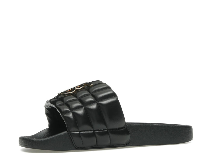 Mules Burberry en agneau matelassé à motif monogramme noir et or